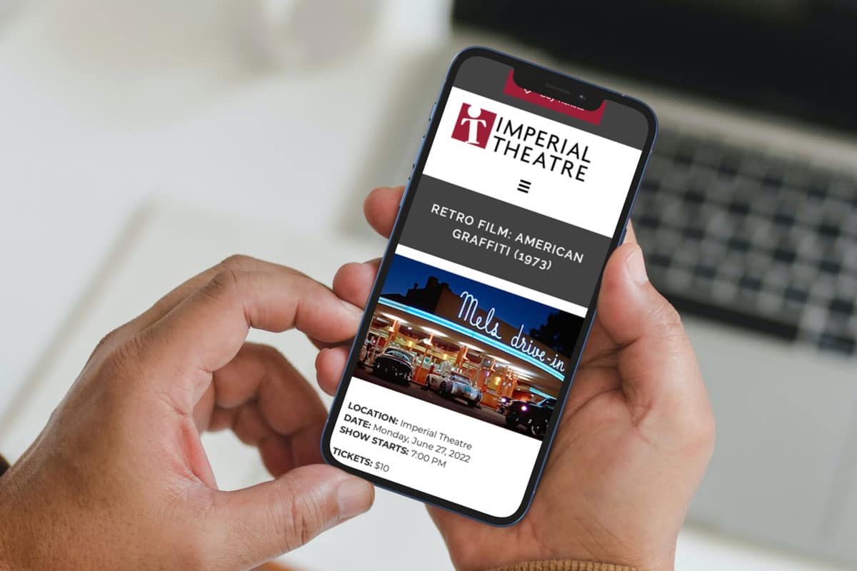 Imperial Theatre Website Design by The Pridham Group displayed on an iPhone.