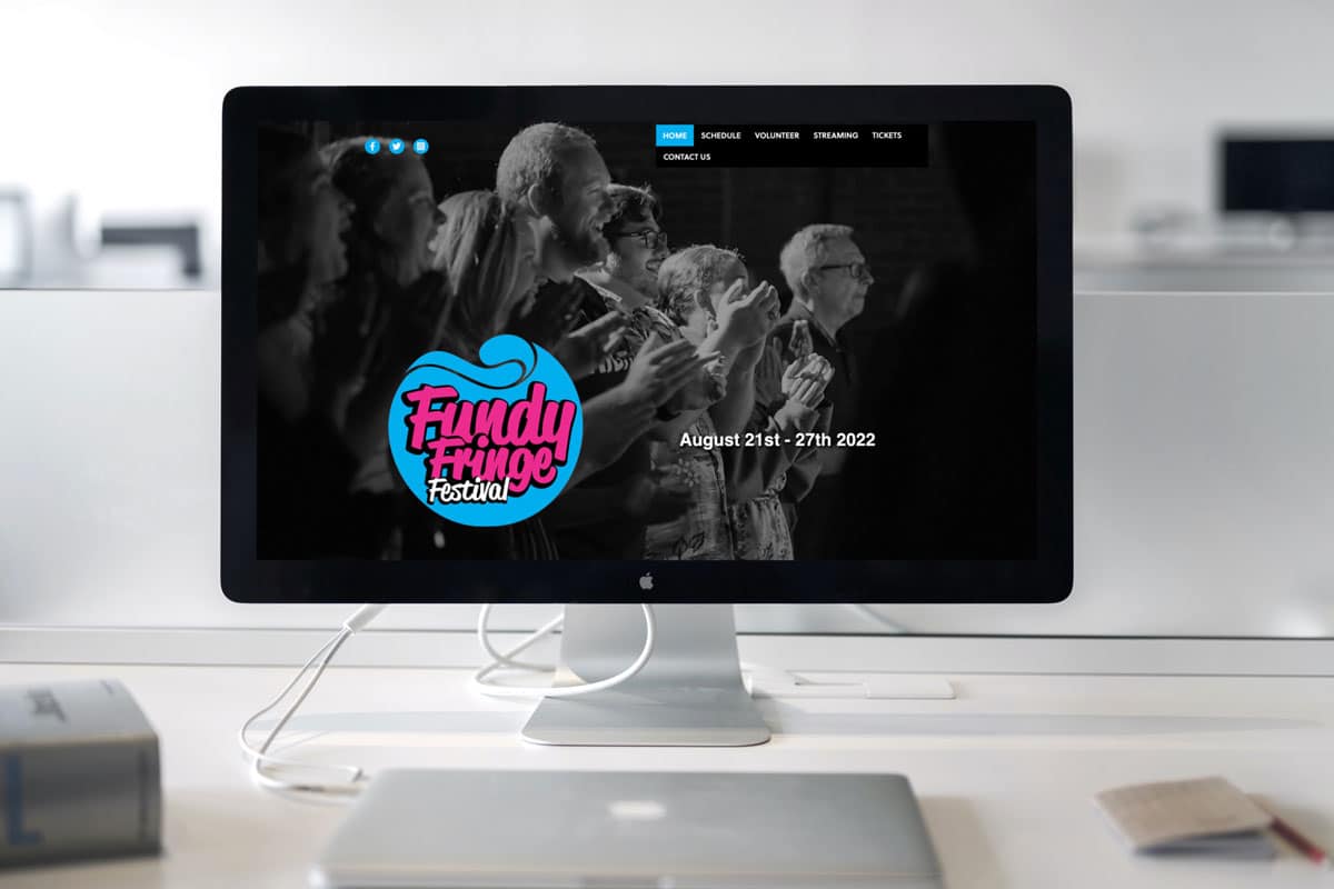 Fundy Fringe Festival website design displayed on an iMac.