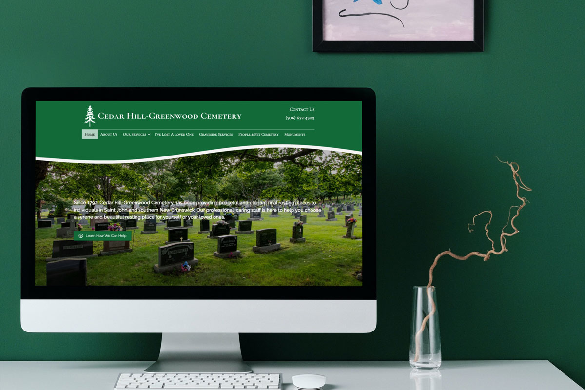 Cedar Hill-greenwood Cemetery website displayed on an iMac.